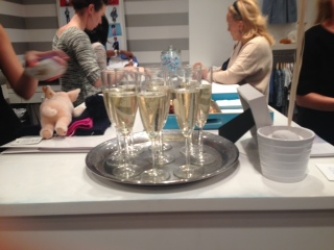 There was champagne on a silver tray. The opening of CZ baby was something like an art opening crossed with a baby shower