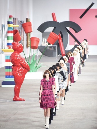 At the Chanel SS14 show in Paris, Lagerfeld turned icons of the Chanel brand–such as the interlocking Cs– into “high art.” The intersection of fashion and art can be lucrative.