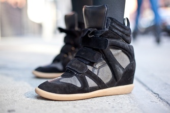 Recently the tribe I study is wearing wedge sneakers rather than just flats. These are Isabel Marant, a popular brand. They make women feel modern, cool, comfortable and, one thing flats can’t do, tall!