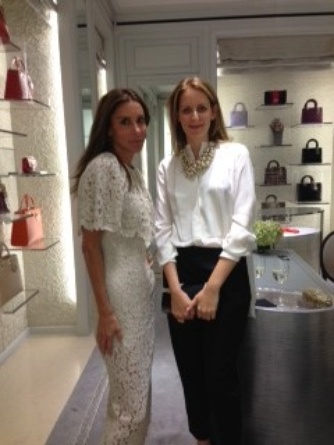 Jackie Sackler (right) in Dior here embodies the New Dior–sophisticated, easy and very modern. She’s with blogger Dori Cooperman (in Dolce Gabbana) Behind them, purses are lighted and displayed like works of art.