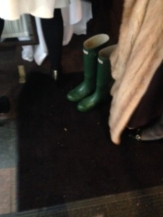 A winter charity luncheon vignette: fur coat, Hunter boots, flats. Women checked their coats and boots and changed into a variety of non-winter footwear….