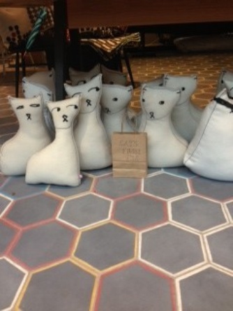 Cats from 30 pounds in Charlene’s shop. They’re doorstops. So clever. And cozy.