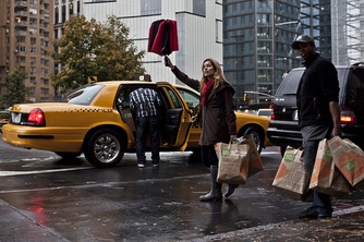 Looking for a stock image I found my friend Regan! She’s doing our least fave thing–hailing a cab in the rain with groceries. Thank goodness the Whole Foods employee is helping her. She will tip him, for sure
